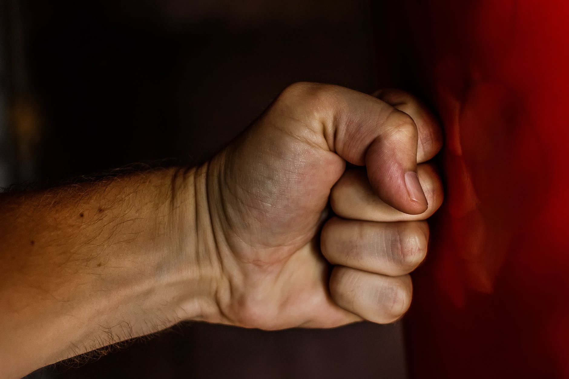 human fist. Releasing anger and stress by punching the heavybag