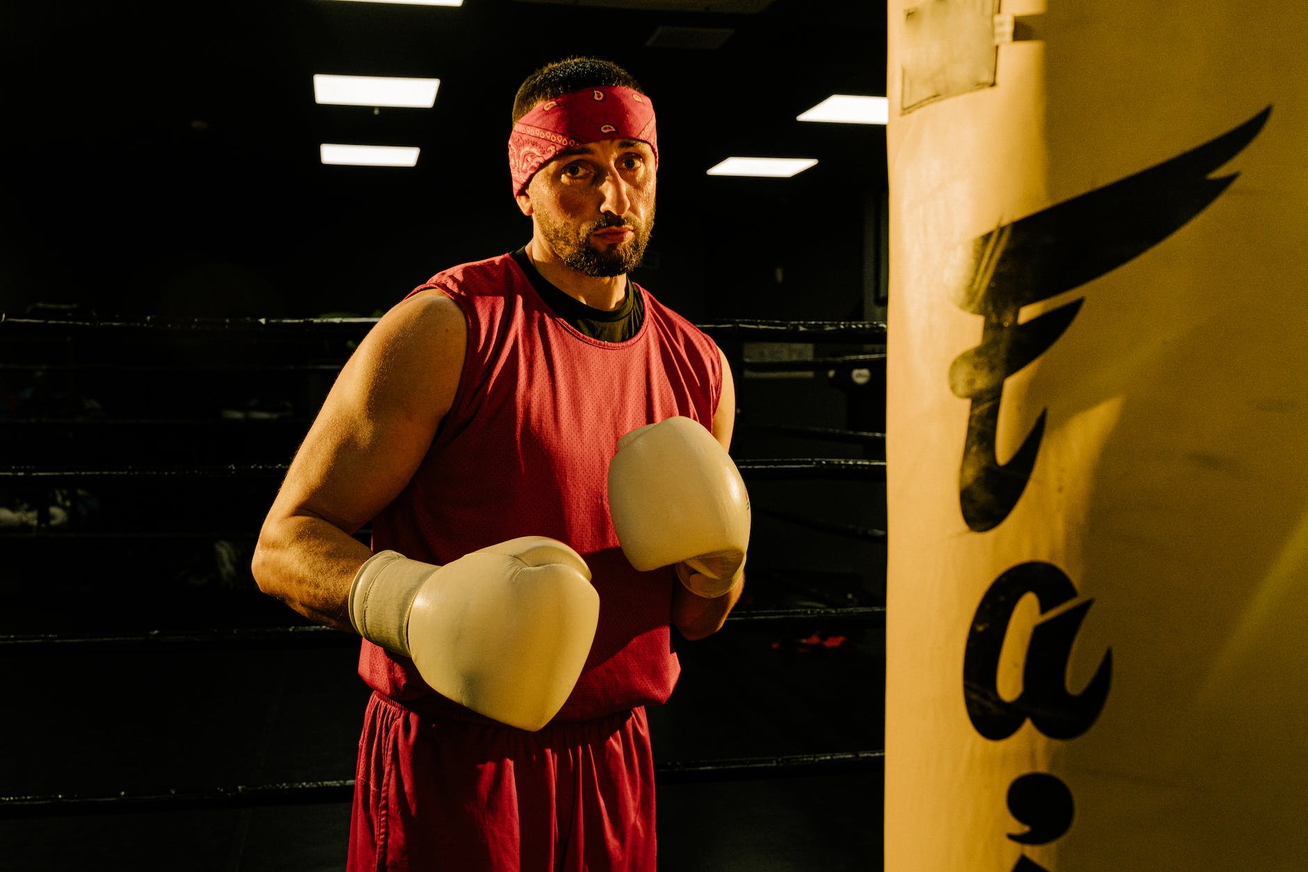 a man training in boxing at the gym. Full of confidence  